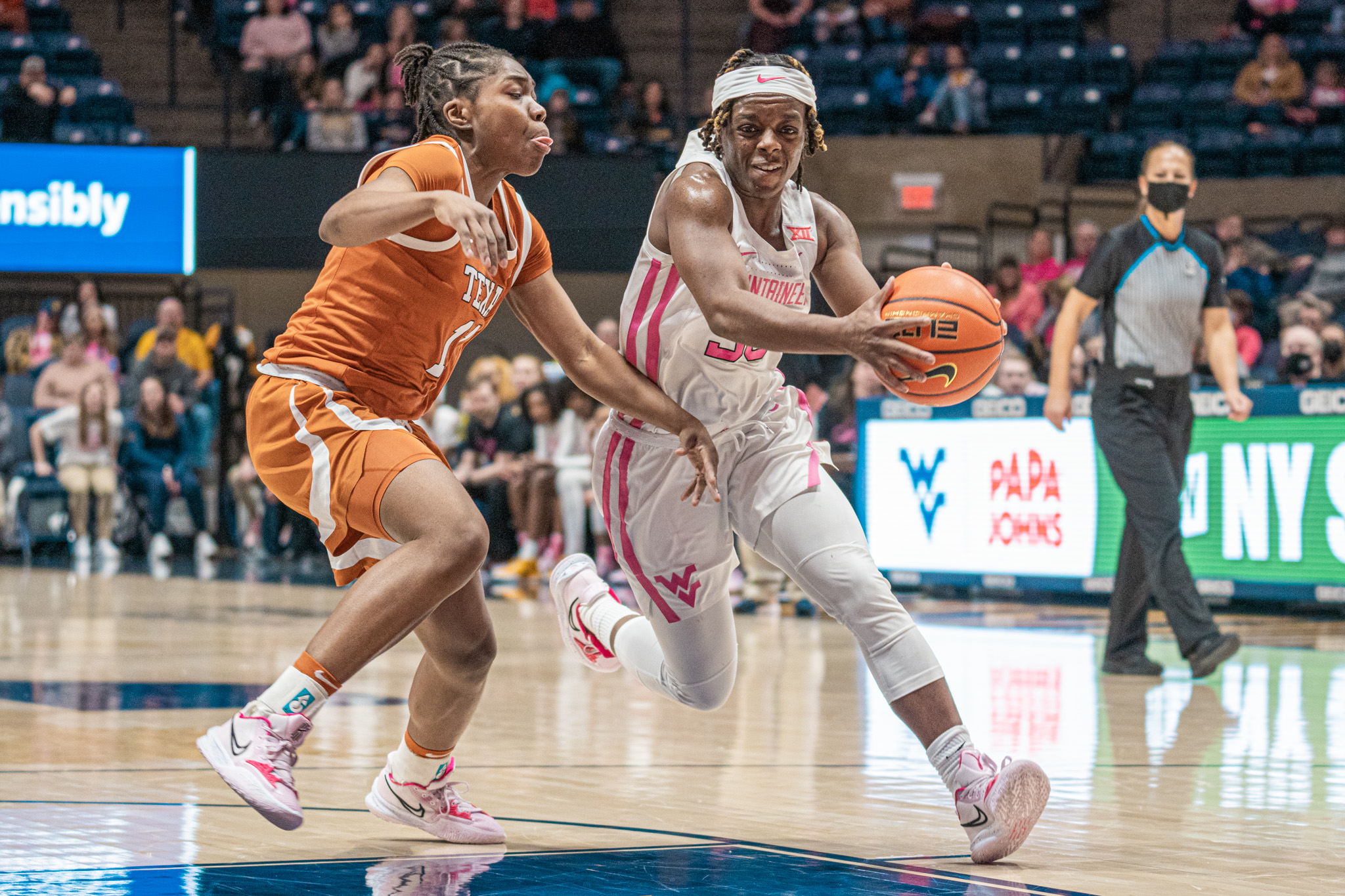 No. 14 Texas uses physical play to hold off West Virginia rally; Kari Niblack injured in loss